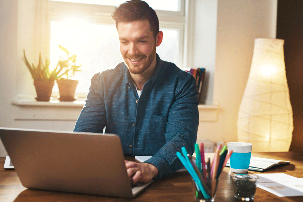 man typing on computer