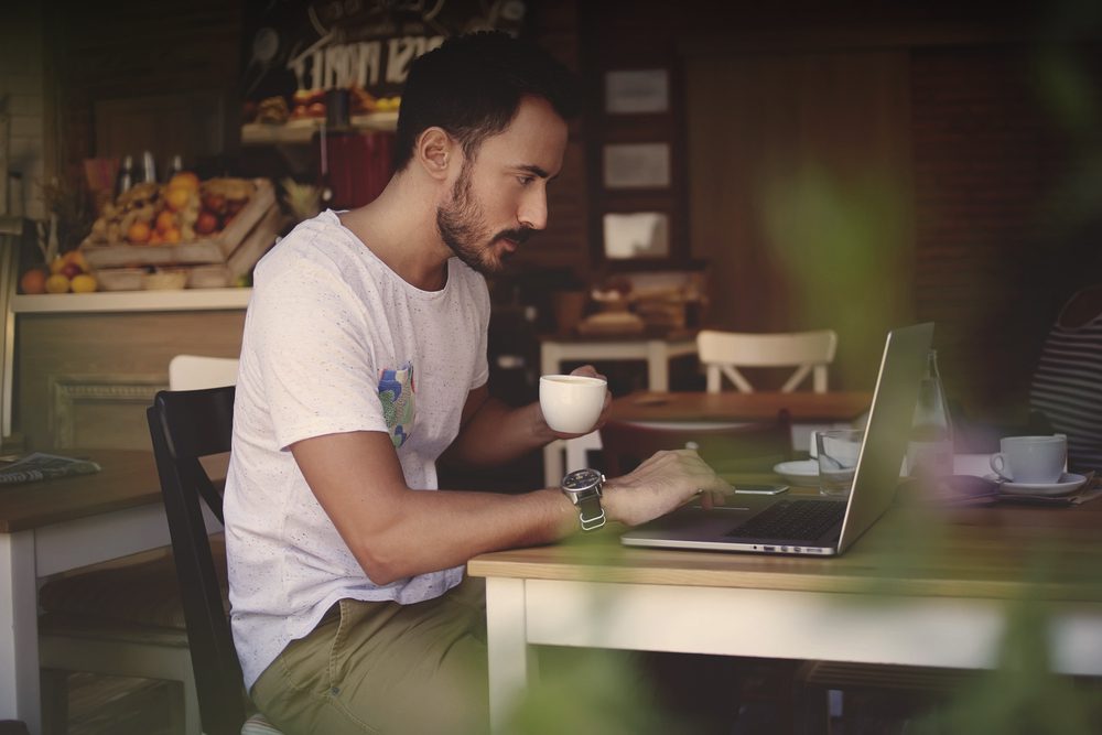 man sitting at computer