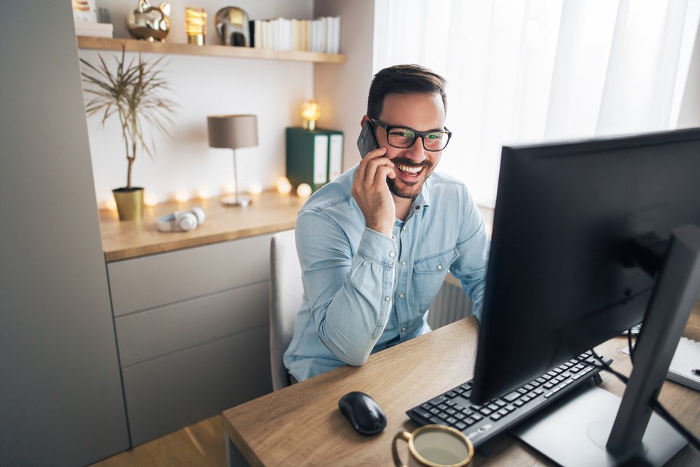 picture of man working from home on the phone